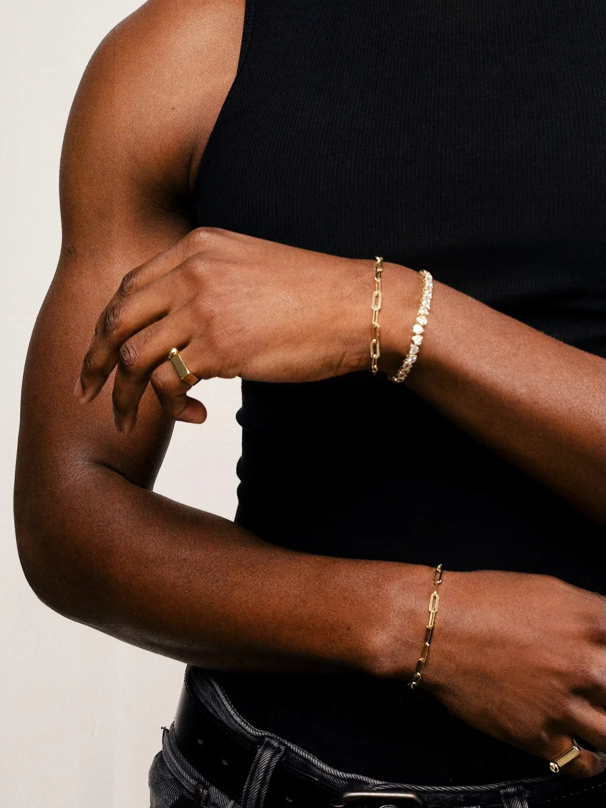 Gold SIMI bracelets styled on arms and hands