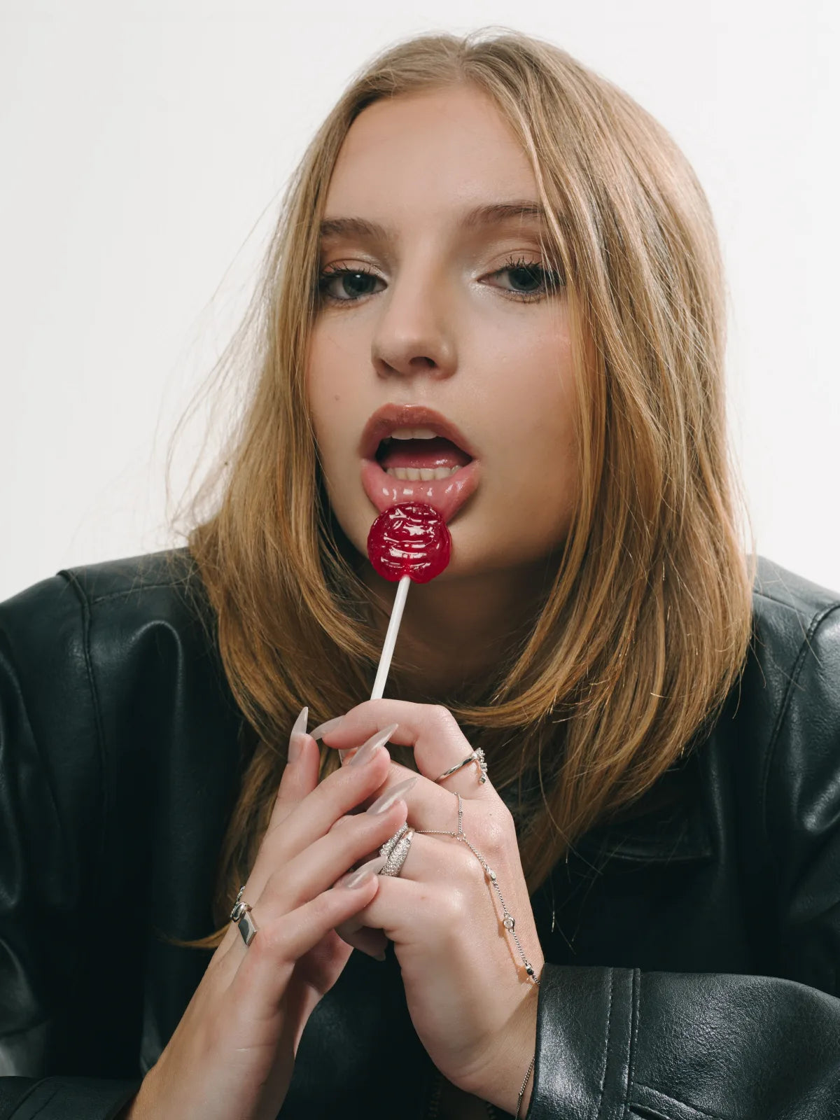 SIMI campaign model with a red lollipop